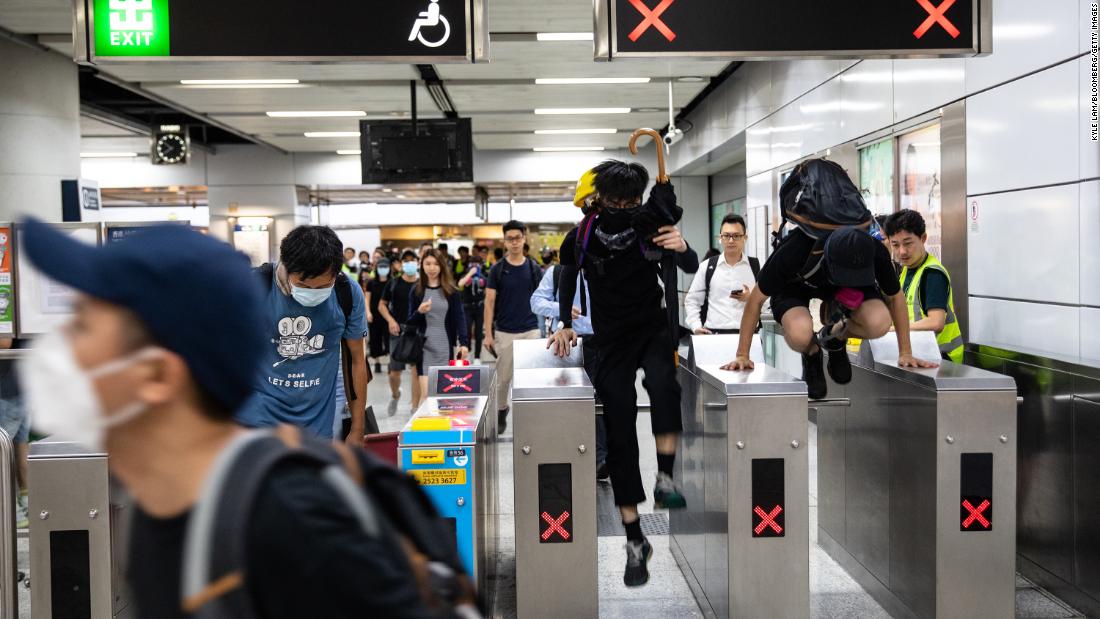 Demonstrators travel through a railway station during a rally on Tuesday, September 3.