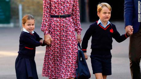 Britain&#39;s Princess Charlotte, left, with her brother Prince George and their parents Prince William and Kate, Duchess of Cambridge, arrives for her first day of school at Thomas&#39;s Battersea in London, Thursday Sept. 5, 2019. (Aaron Chown/Pool via AP)