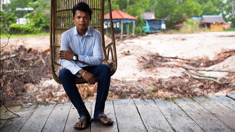 Sina, the son-in-law of Sok Sabay Resort&#39;s owner, sits on a veranda that used to look out onto a pretty pond. It has now been filled out to make way for a construction site.