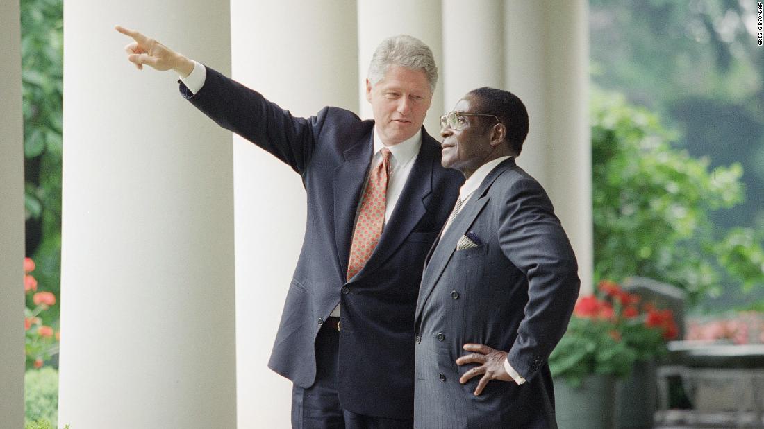 US President Bill Clinton gestures while talking to Mugabe after a White House meeting in Washington in May 1995.