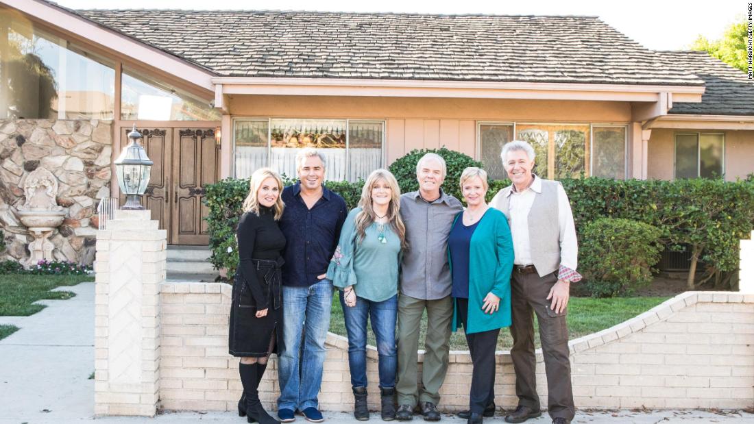 Maureen McCormick, Christopher Knight, Susan Olsen, Mike Lookinland, Eve Plumb and Barry Williams in front of the original Brady home in Studio City, CA, as seen on 'A Very Brady Renovation.'