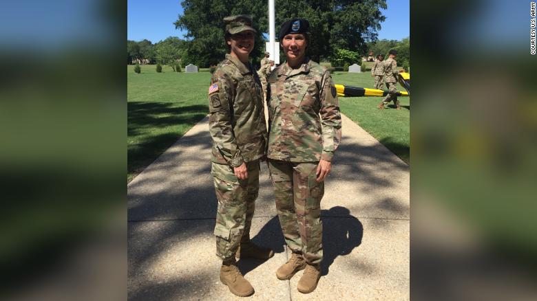 Maj. Gen. Maria Barrett and her sister, Brig. Gen. Paula Lodi, pose for a family photo after then Col. Lodi&#39;s outgoing Change of Command for the 44th Medical Brigade, Fort Bragg, N.C. in July 2018.