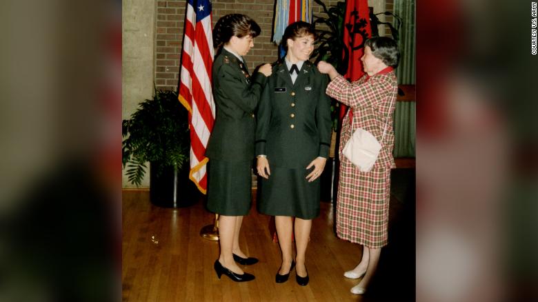 Maj. Gen. Maria Barrett and her mother, Clara Lodi, pin 2d Lt. rank on Paula Lodi during a commissioning ceremony at Rutgers University, 1990.