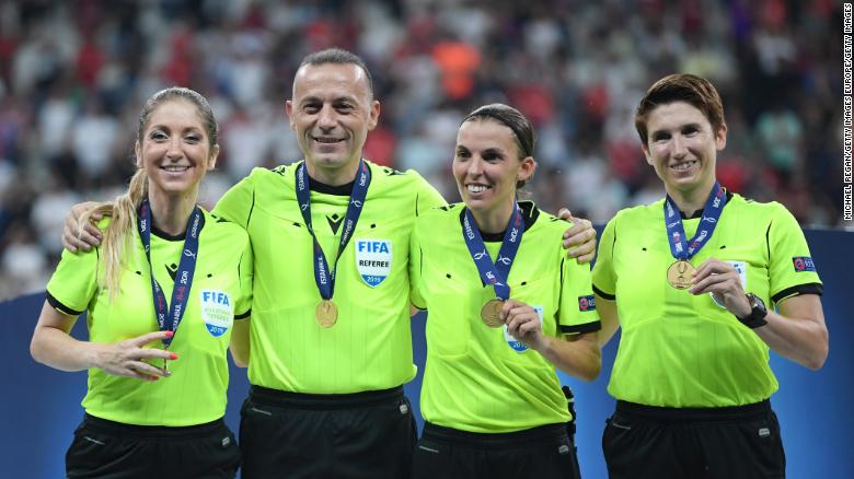 (L-R): Manuela Nicolosi, fourth official,CÃ¼neyt ÃakÄ±r, Stephanie Frappart and Michelle O Neill pose with their medals following the UEFA Super Cup final.
