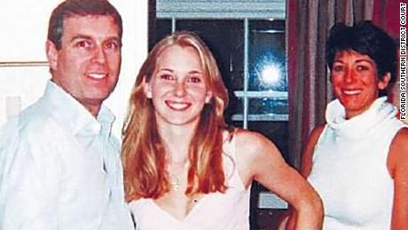 A photograph appearing to show Prince Andrew with Jeffrey Epstein accuser Virginia Giuffre and, in the background, Ghislaine Maxwell.