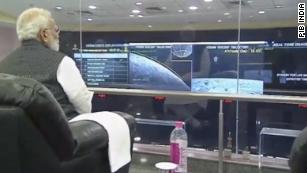 Prime Minister Narendra Modi  watching the landing.