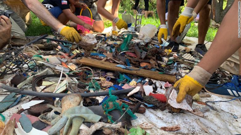 A crew sorts through marine debris on Easter Island.