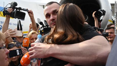 Oleg Sentsov hugs his daughter in Kyiv after being released from Russian prison in 2019.
