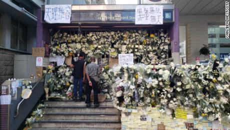 Floral tributes close off an entrance at Hong Kong&#39;s Prince Edward MTR station, after protesters accuse police of using excessive violence in the station.