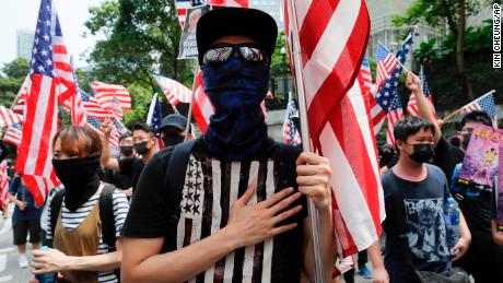 Demonstrators in Hong Kong march to the US Consulate on Sunday to drum up international support for their protest movement.