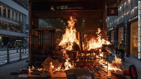 A barricade burns at an entrance to a train statio on September 8 in Hong Kong, China.