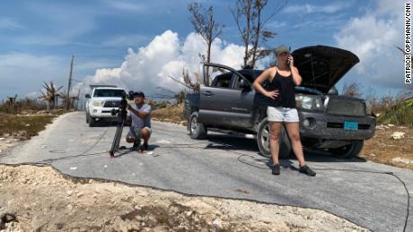 CNN producer Jaide Timm- Garcia and photojournalist Jose Armijo set up for a liveshot from the hard hit town of High Rock in Grand Bahama Island.