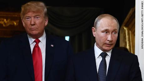 US President Donald Trump (L) and Russian President Vladimir Putin arrive for a meeting in Helsinki, on July 16, 2018. 