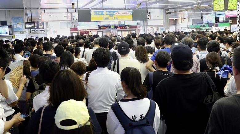 Commuters at a Japan Railways station, where trains were suspended due to Typhoon Faxai in Saitama on September 9, 2019.
