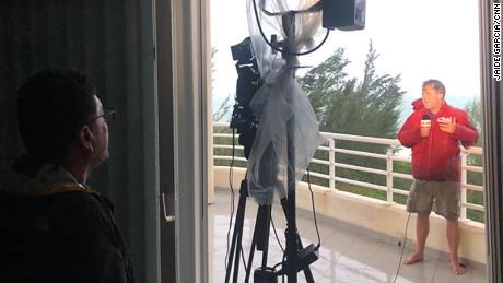 Jose Armijo shoots Patrick Oppmann&#39;s live shot from the balcony of an ocean-view apartment as Hurricane Dorian pounds the town of Freeport on September 2.