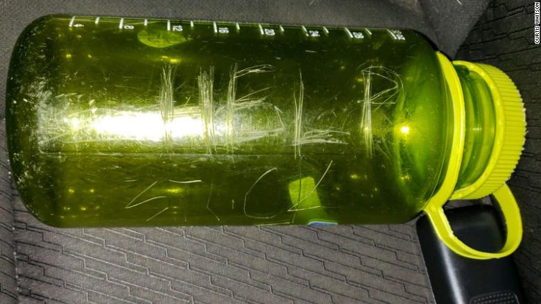 The family carved 'HELP' on a green bottle