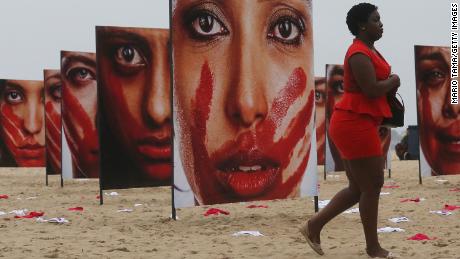 Images of models portraying women who have been abused at a demonstration opposing violence against women on Copacabana beach in 2016.
