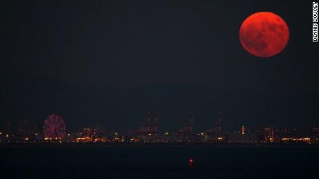 Doucet took this image in 2015 that shows the &quot;blood&quot; moon rising above Osaka, Japan.