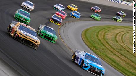Cars race during the Monster Energy NASCAR Cup Series Quaker State 400 on July 13, 2019, at Kentucky Speedway in Sparta, Kentucky. 