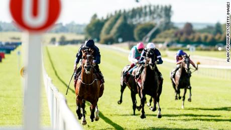 Ryan Moore riding Flag Of Honour (left) to win the Irish St. Leger at the Curragh in 2018.