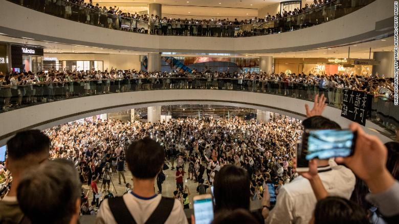 Protesters sing songs and shout slogans after gathering at the IFC Mall on September 12, 2019 in Hong Kong.