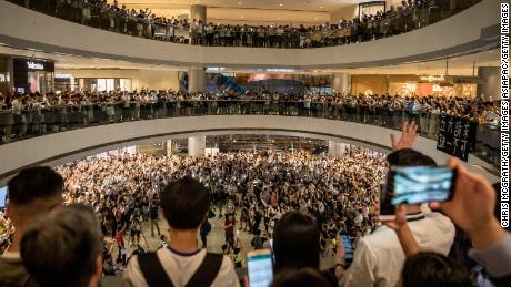 Protesters sing songs and shout slogans after gathering at the IFC Mall on September 12, 2019 in Hong Kong.