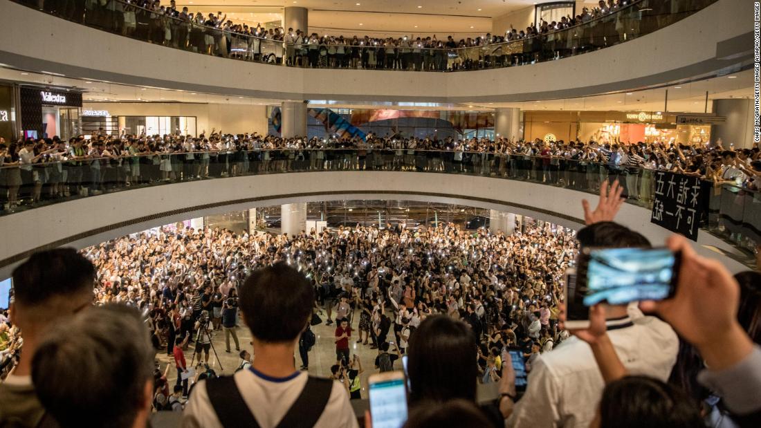 Protesters sing songs and shout slogans after gathering at the IFC Mall on September 12, 2019 in Hong Kong.