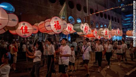 Participants take part in the annual Tai Hang &quot;fire dragon&quot; event, one of the highlights of the city&#39;s mid-autumn festival, in Hong Kong on September 12, 2019.