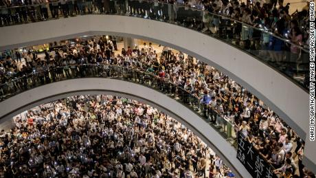 Hundreds of Hong Kong protesters sing defiant anthem