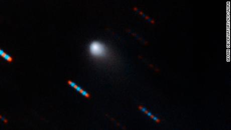 Gemini Observatory two-color composite image of C/2019 Q4 (Borisov) which is the first interstellar comet ever identified. This image was obtained using the Gemini North Multi-Object Spectrograph (GMOS) from Hawaii&#39;s Maunakea. The image was obtained with four 60-second exposures in bands (filters) r and g. Blue and red dashes are images of background stars which appear to streak due to the motion of the comet. Composite image by Travis Rector.
Image Credit: Gemini Observatory/NSF/AURA
