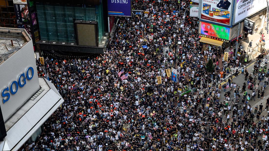 Live: Hong Kong police fire tear gas, water cannon after protesters hurl petrol bombs - CNN