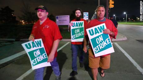 United Auto Workers members picket outside the General Motors Detroit-Hamtramck assembly plant in Hamtramck, Michigan early on Monday.