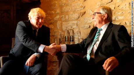 European Commission President Jean-Claude Juncker, right, poses with  Boris Johnson before  meeting at a restaurant in Luxembourg. 