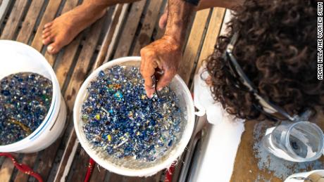 Team member Yoav Nevo counting pieces of microplastic.