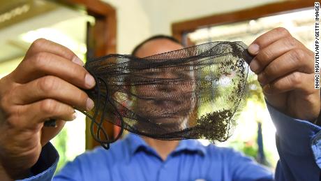 Field officer Luu Quoc Hung from the World Mosquito Program holds a bag of mosquitoes in the southern Vietnamese city of Nha Trang.