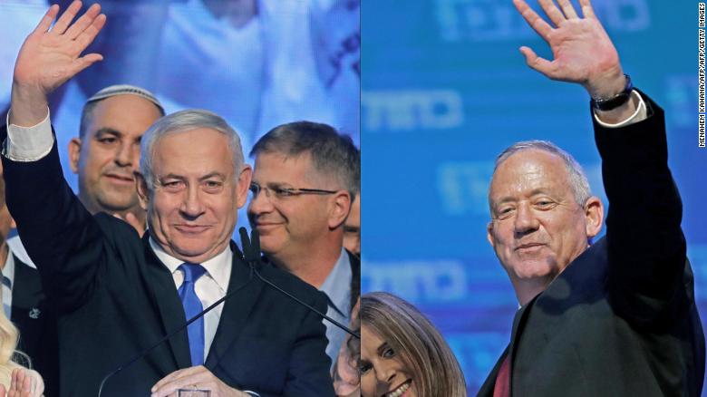 (COMBO) This combination of pictures created on September 18, 2019 shows Israeli Prime Minister Benjamin Netanyahu (L) waving to supporters at his Likud party's electoral campaign headquarters early on September 18, 2019, and Benny Gantz, leader and candidate of the Israel Resilience party that is part of the Blue and White (Kahol Lavan) political alliance, waving to supporters alongside his wife Revital Gantz at the alliance's campaign headquarters in the Israeli coastal city of Tel Aviv early on September 18, 2019. - Netanyahu and his main challenger Gantz were locked in a tight race in the country's general election after polls closed, exit surveys showed, raising the possibility of another deadlock. Three separate exit polls carried by Israeli television stations showed Netanyahu's right-wing Likud and Gantz's centrist Blue and White alliance with between 31 and 34 parliament seats each out of 120. (Photos by Menahem KAHANA and EMMANUEL DUNAND / AFP) (Photo credit should read MENAHEM KAHANA,EMMANUEL DUNAND/AFP/Getty Images)