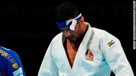 In this picture taken on August 28, 2019, Iran&#39;s Saeid Mollaei (in white) fights against Belgium&#39;s Matthias Casse during the semi-final of the men&#39;s under 81kg category during the 2019 Judo World Championships at the Nippon Budokan, a venue for the upcoming Tokyo 2020 Olympic Games, in Tokyo. - Iranian judo star Saeid Mollaei, who claimed he was ordered to deliberately lose a world championship fight, could compete under a refugee flag at the 2020 Tokyo Olympics, officials said on September 1. (Photo by Charly TRIBALLEAU / AFP)        (Photo credit should read CHARLY TRIBALLEAU/AFP/Getty Images)