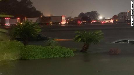 Vehicles were nearly submerged Thursday morning near the Elegante Hotel in Beaumont.