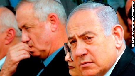 Israeli Prime Minister Benjamin Netanyahu (R), Israeli president of the Supreme Court Esther Hayut (C) and Benny Gantz (L), leader of Blue and White party, attend a memorial ceremony for late Israeli president Shimon Peres, at Mount Herzl in Jerusalem on September 19, 2019. - Netanyahu called on his main challenger Benny Gantz to form a unity government together, a major development after deadlocked election results put his long tenure in office at risk. (Photo by GIL COHEN-MAGEN / AFP)        (Photo credit should read GIL COHEN-MAGEN/AFP/Getty Images)