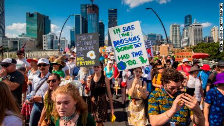 Climate protestors pictured at a rally in Brisbane.