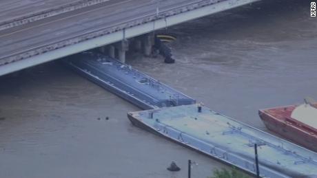 Several barges broke away from a Houston shipyard, striking a bridge, officials said Friday.