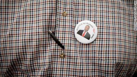 Botham Jean&#39;s pastor, Sammie Berry from the Dallas West Church of Christ, wears a button supporting &quot;Justice for Botham.&quot;