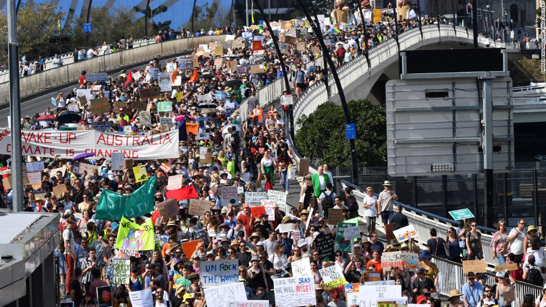 Climate change protesters cross the Victoria Bridge in Brisbane, Australia.