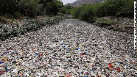 India throws out over 9 million tons of plastic per year. Here, garbage floats along a river in Ajmer, in the Indian state of Rajasthan. 