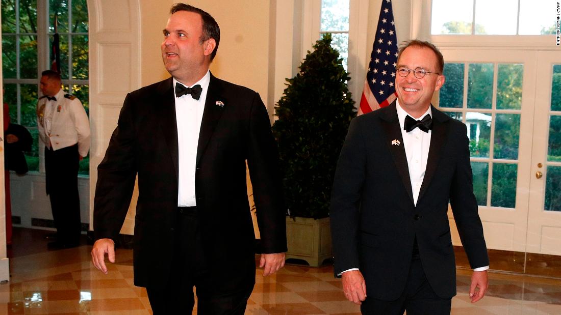 White House social media director Dan Scavino, left, and White House chief of staff Mick Mulvaney 