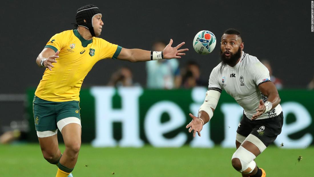 Waisea Nayacalevu of Fiji, right, beats Christian Lealifano to the ball to score a second-half try. However, two tries from Australia hooker Tolu Latu in five minutes ensured the Wallabies avoided a huge upset.