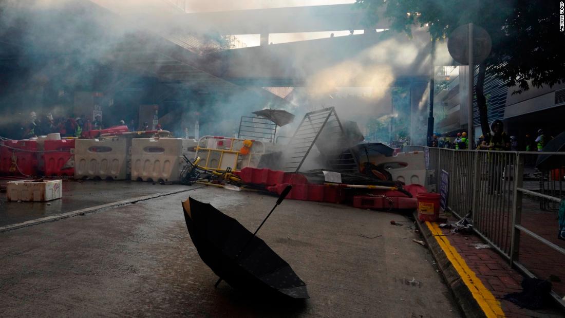 An umbrella is abandoned near barricades during a protest in Hong Kong on Saturday, Sept. 21, 2019. Demonstrators have marched through an outlying district of Hong Kong in another weekend of protest aimed at the Chinese territory's government.