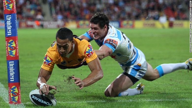 Folau of the Broncos scores a try in the NRL.