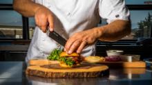 Moss Landing, CA - September 5, 2019: Chef Tucker Bunch prepares Sweet Earth's "Awesome Burger" in the test Kitchen at their Moss Landing headquarters. 
