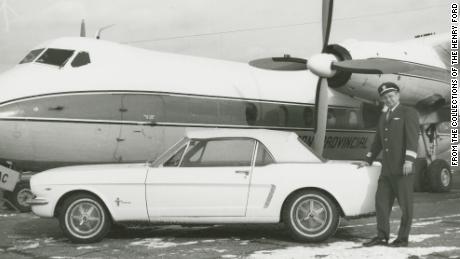 Tucker stands next to the car in 1966.